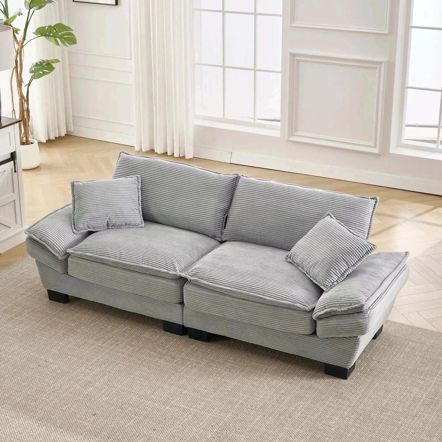 Canapé-Lit 2 Places in soft grey velvet with deep seating and modern design in a bright living room