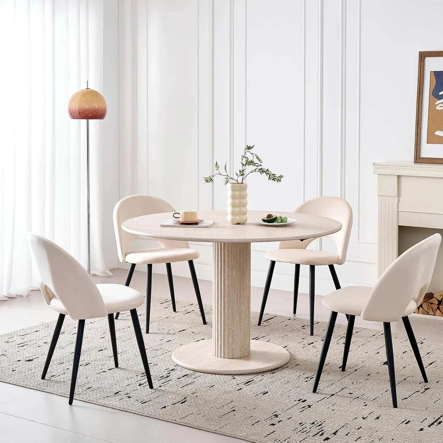 Modern round solid wood dining table for 4-6 people with beige chairs in a stylish Nordic design room