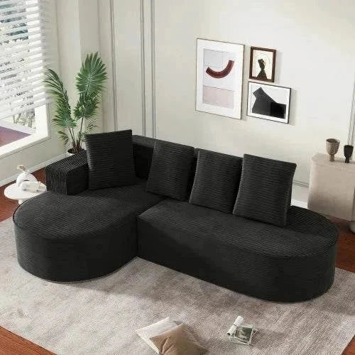 Modern black velour Canapé Sectionnel L-Shape sofa with high-elasticity foam and four cushions in a spacious living room.