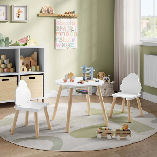 White children's table with two matching chairs in a playroom setting
