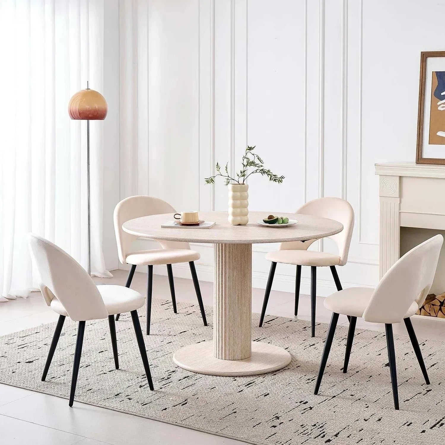 Modern round solid wood dining table for 4-6 people with beige chairs in a stylish Nordic design room